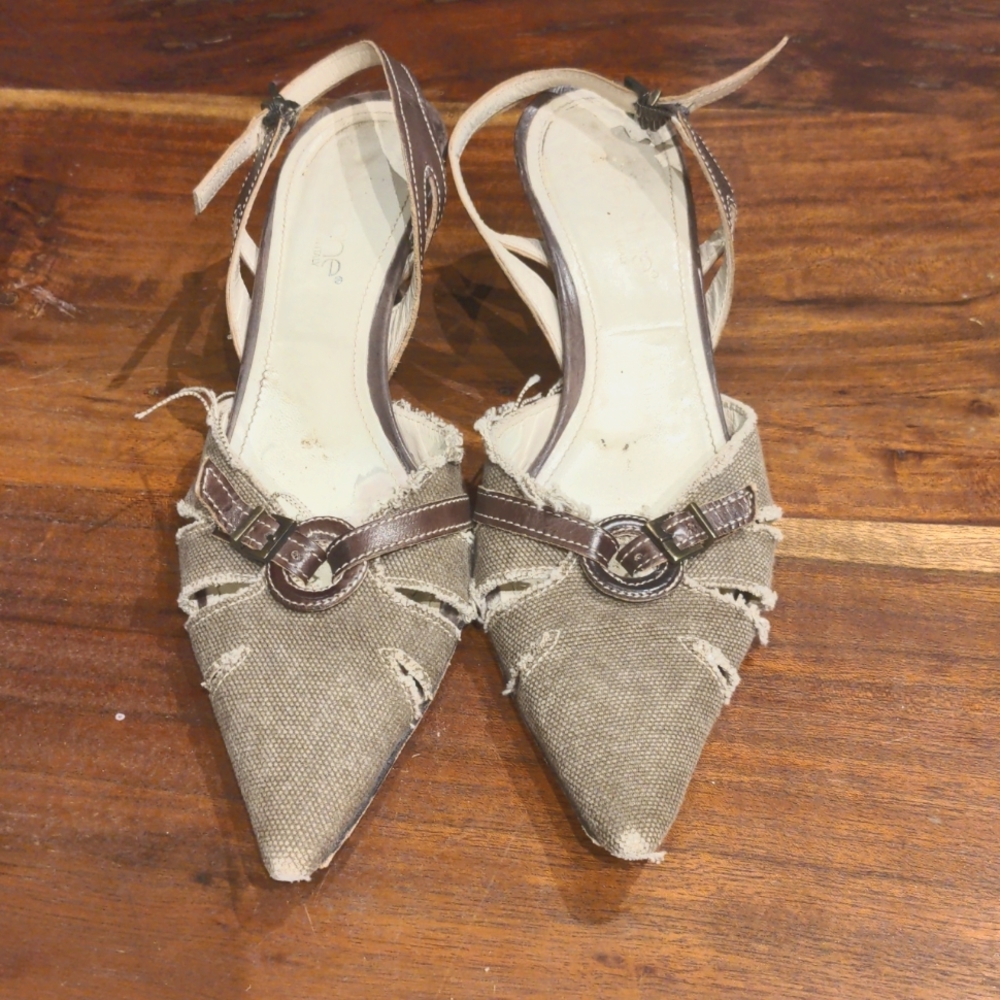 Linen and leather distressed kitten heels.
